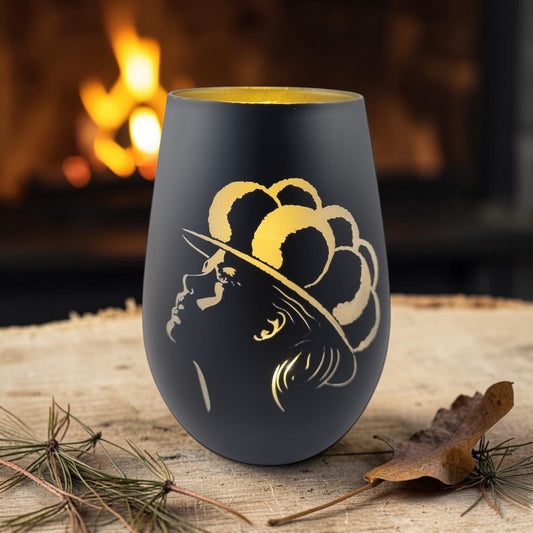 Schwarzwald Gravur black glass windlight with gold engraving of a woman's profile wearing a hat.