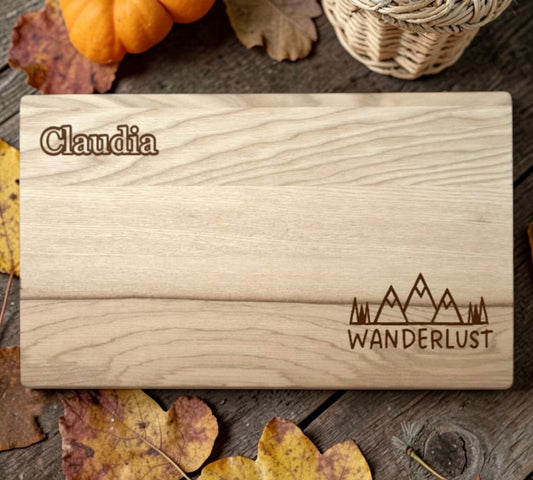 Schwarzwald Gravur rectangular ash wood cutting board with 'Claudia' and mountain graphic engraved