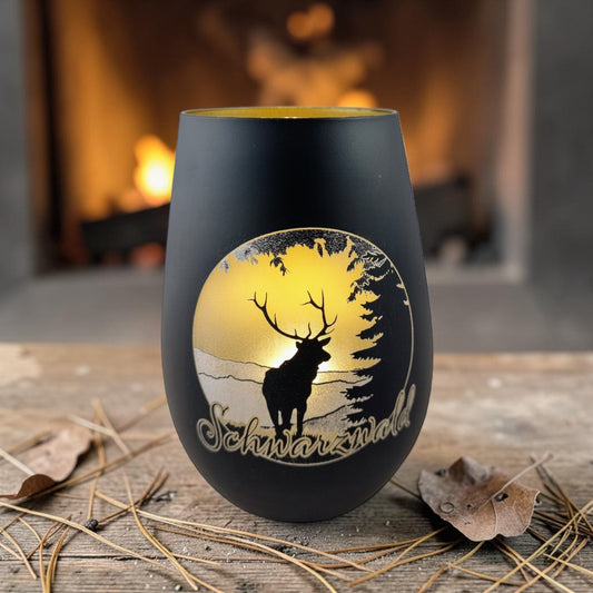 Schwarzwald Gravur black glass lantern with laser-etched deer panorama and golden interior. Made in Germany.